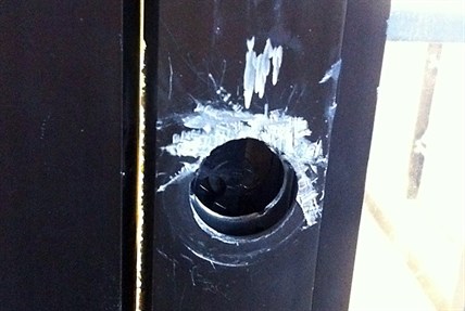 The lock on the front door of Lens and Shutter in Kelowna was broken off.