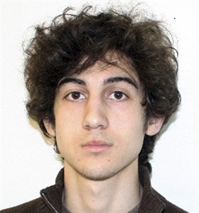 This photo released Friday, April 19, 2013 by the Federal Bureau of Investigation shows a suspect that officials identified as Dzhokhar Tsarnaev, being sought by police in the Boston Marathon bombings Monday. 