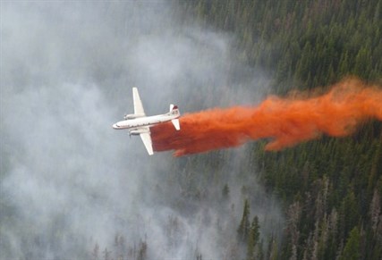 Retardant is dropped on a fire in 2009. Two of these aircraft worked the Kamloops Lake fire on Saturday, laying a retardant guard.