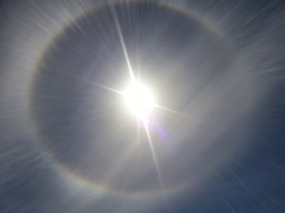 A picture in a tweet Saturday afternoon of the sun encircled by a halo of refracted light called a sun dog.