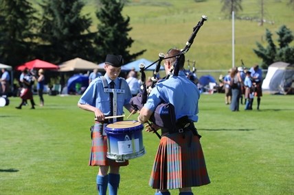 A drummer and a piper compete at the Kamloops Highland Games.