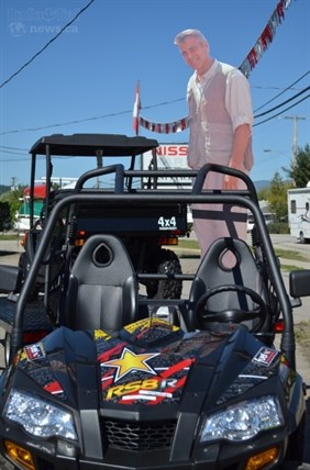 George hangs out atop an ATV at a local Enderby business. 