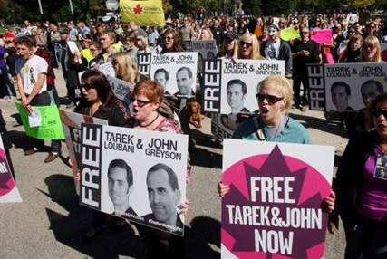 A rally calling for the release of jailed Canadians Tarek Loubani and John Greyson is held in London, Ont., earlier this week. The pair have been detained in Cairo since mid-August.