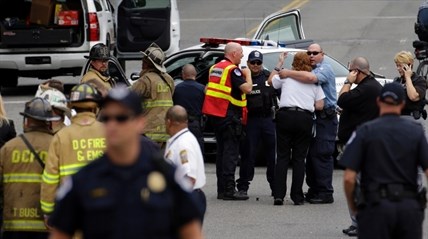 Police gather near the scene on Capitol Hill in Washington, Thursday, Oct. 3, 2013, after gunshots were heard.