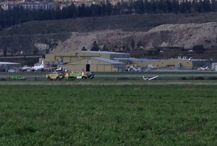 The wing and tail of a small crashed Cessna can be seen poking out of the creek bed just off gate two at YLW.