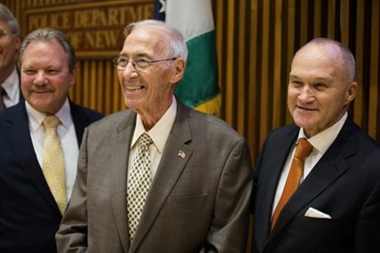 Former NYPD detective Jerry Giorgio smiles alongside Commissioner Ray Kelly, right.
