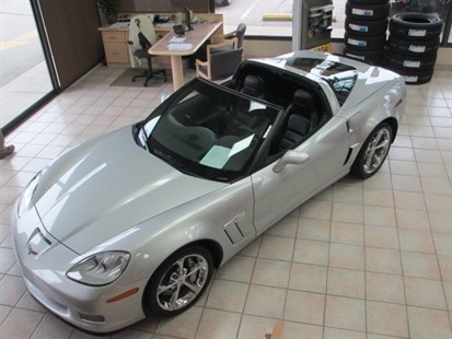 Thieves drove this 2011 Corvette through the glass wall of a Penticton car dealer Thursday night.The suspects are still at large.