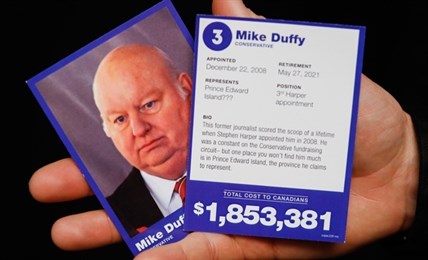 ‘Represents: Prince Edward Island???’ A Mike Duffy trading card.