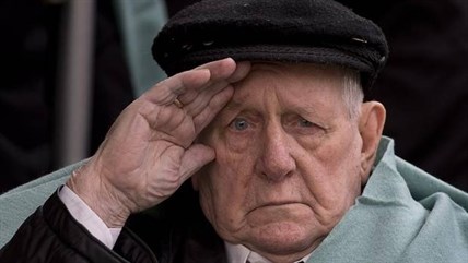 Allan Tanner, 88, salutes at the Remembrance Day ceremonies at the Grande Parade in Halifax on Monday, Nov. 11, 2013. Tanner joined the merchant navy in 1939 at age 14.