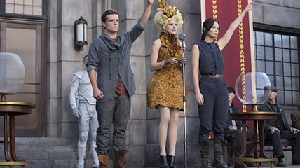 Josh Hutcherson as Peeta Mellark (from left to right) Elizabeth Banks as Effie Trinket and Jennifer Lawrence as Katniss Everdeen in a scene from 'The Hunger Games: Catching Fire’.