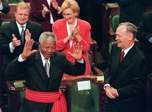 South African President Nelson Mandela is given a standing ovation in the House of Commons on Parliament Hill in Ottawa Thursday Sept, 24, 1998. The former South African president, who spent much of 2013 in and out of the hospital, died Thursday, Dec. 5, 2013 at age 95. 