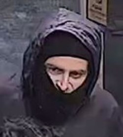 A close-up of the suspect's face.