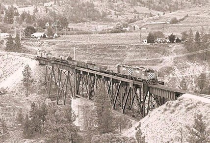 This photo, believed to be from 1989, late March or very early April,is one of the “last trains” heading to Penticton.  It is crossing the Trout Creek bridge near Summerland.
