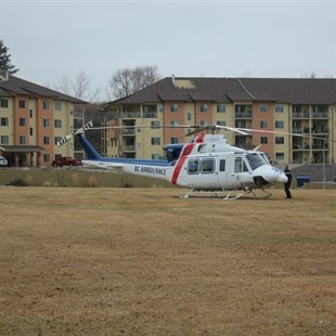 A BC Air Ambulance helicopter lands in Oliver to airlift the victims of an an Osoyoos house fire on Friday, Jan. 18, 2014. The couple, who were badly burned, were taken by ambulance to hospital in Oliver before they were airlifted, one to Kelowna and one to Vancouver.