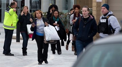 Shoppers are evacuated by police after a shooting at The Mall in Columbia in Columbia, Md. on Saturday, Jan. 25, 2014.