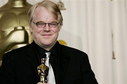 In a Sunday, March 5, 2006 Philip Seymour Hoffman poses with the Oscar he won for best actor for his work in 