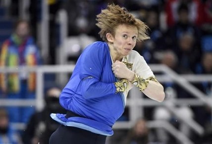 Canada's Kevin Reynolds performs his free program in the men's portion of the figure skating team event at the Sochi Winter Olympics Sunday, February 9, 2014 in Sochi.