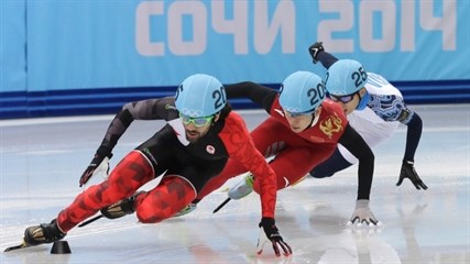 Charles Hamelin of Canada, left, Han Tianyu of China, centre, and Victor An of Russia compete in a men's 1500m short track speedskating final at the Iceberg Skating Palace during the 2014 Winter Olympics in Sochi, Monday, Feb. 10, 2014.