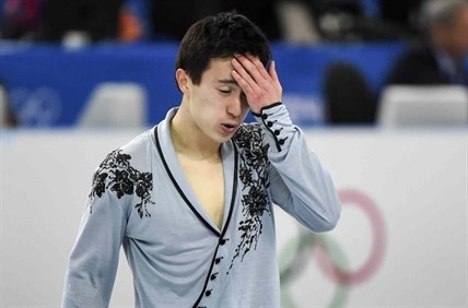 Canada's Patrick Chan reacts at the end of his silver medal-winning men's free program.