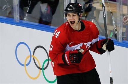 Chris Kunitz of Canada celebrates his goal against Sweden during the third period of the men’s gold medal hockey game.