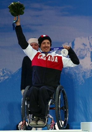 Vernon's Josh Dueck celebrates his silver medal in the mens sitting skiing downhill during the 2014 Paralympic Games on Saturday, Mar. 8, 2014.