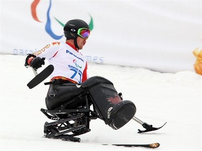 Vernon's Josh Dueck competes in the men's super combined sit ski event on March 14, 2014 at the 2014 Sochi Paralympic Winter Games in Sochi. Dueck went on to win the gold medal.