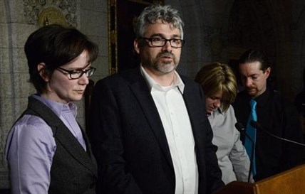 Rehtaeh Parson's father Glen Canning, second from left, speak to reporters in Ottawa on April 23, 2013.
